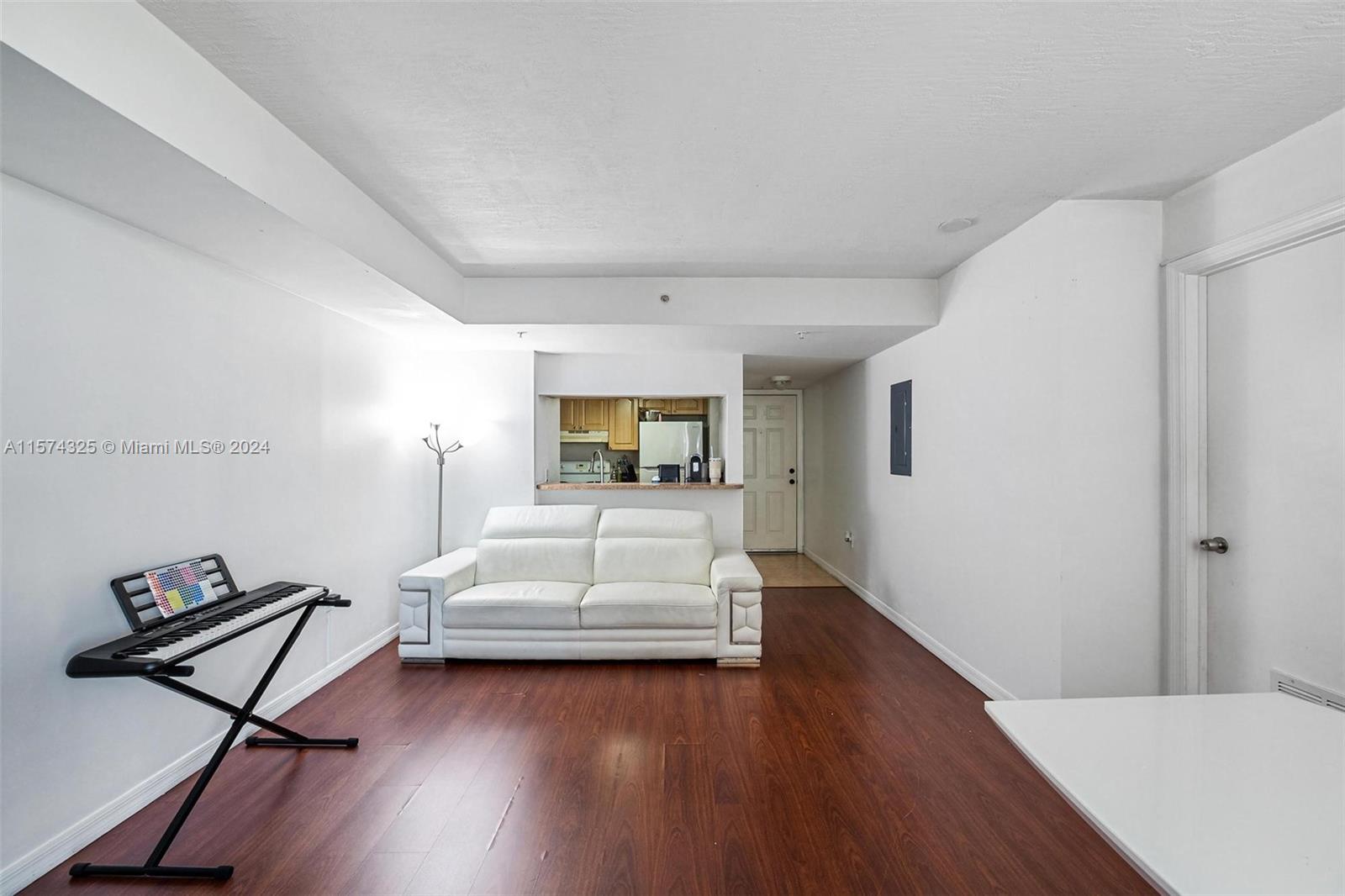 102 Southwest 6th Avenue, Unit 401 Miami, FL 33130 - Photo 7 of 27 a bedroom with furniture and a wooden floor
