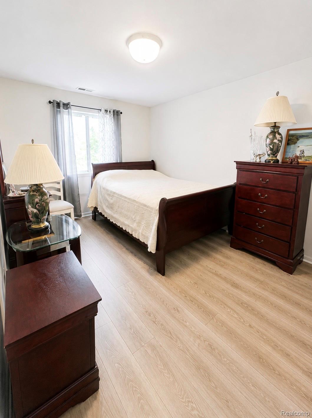 29838 Utica Road, Unit 25 Roseville, MI 48066 - Photo 8 of 15 Bedroom with light wood-style flooring