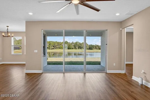 a view of hallway with wooden floor