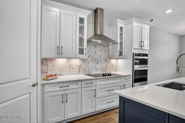 a bedroom with a bed and a wooden floor