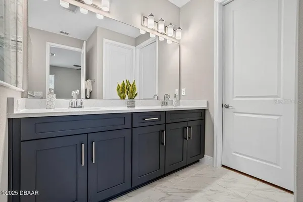 a view of a big room with wooden floor and windows