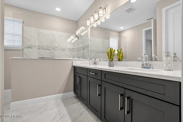 an empty room with a window and a ceiling fan