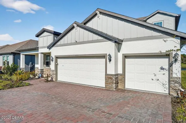 a view of a house with swimming pool and a yard