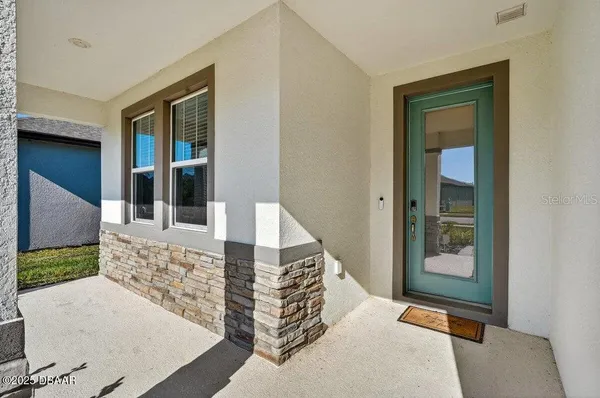 a living room with furniture and a garden