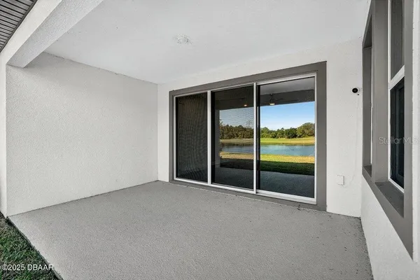 a view of hallway with wooden floor