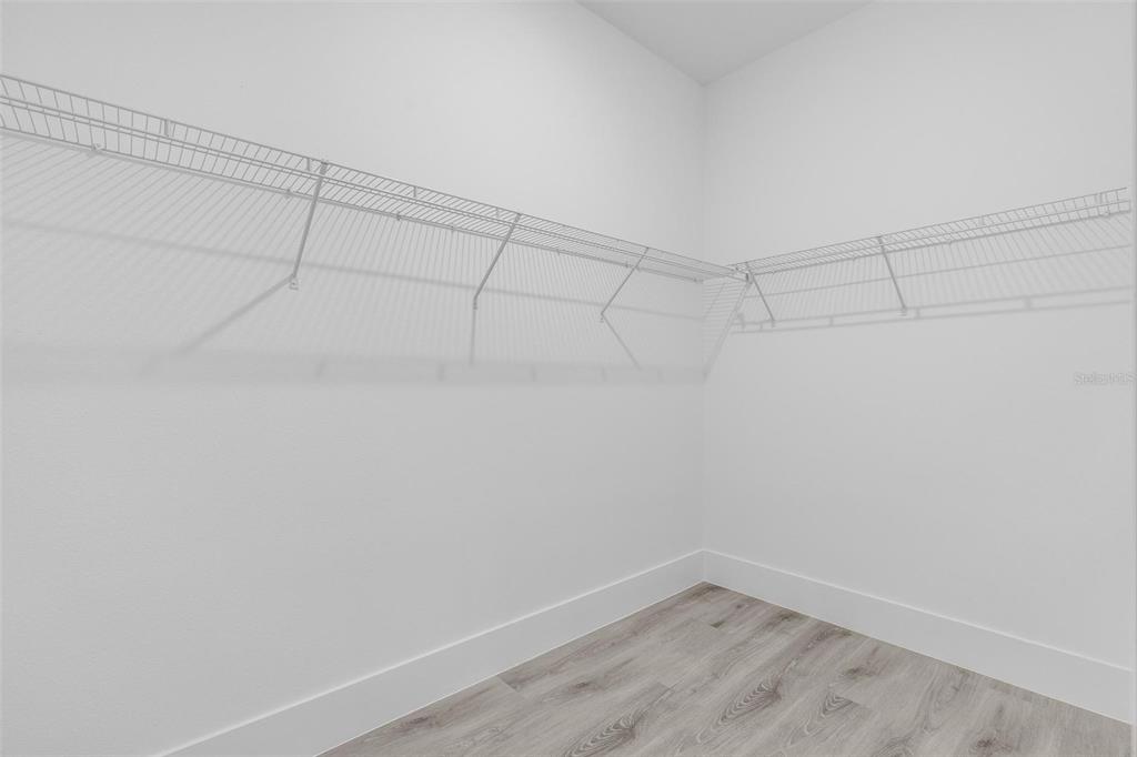 3172 Southwest 137th Loop Ocala, FL 34473 - Photo 21 of 38 a view of a room with racks on the wall