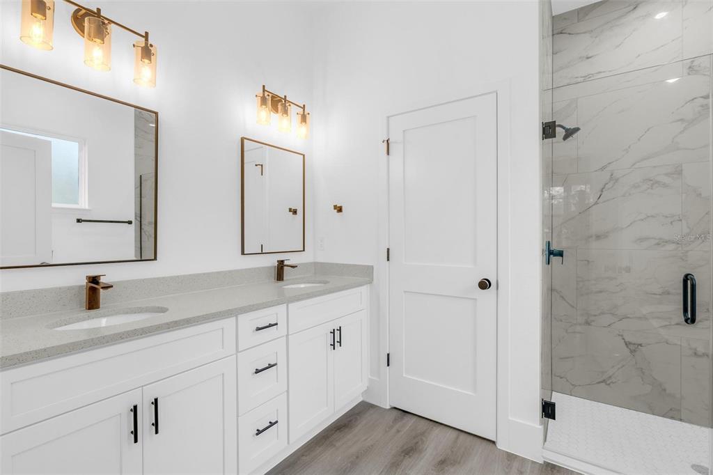 3172 Southwest 137th Loop Ocala, FL 34473 - Photo 22 of 38 a bathroom with a double vanity sink and mirror