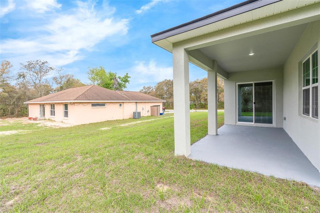 3172 Southwest 137th Loop Ocala, FL 34473 - Photo 32 of 38 a view of a house with backyard and porch