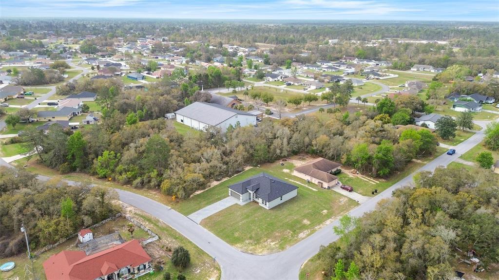 3172 Southwest 137th Loop Ocala, FL 34473 - Photo 34 of 38 an aerial view of residential houses with outdoor space