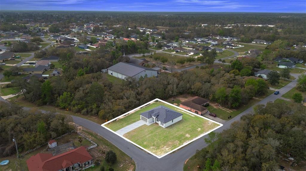 3172 Southwest 137th Loop Ocala, FL 34473 - Photo 35 of 38 an aerial view of residential houses with outdoor space and trees