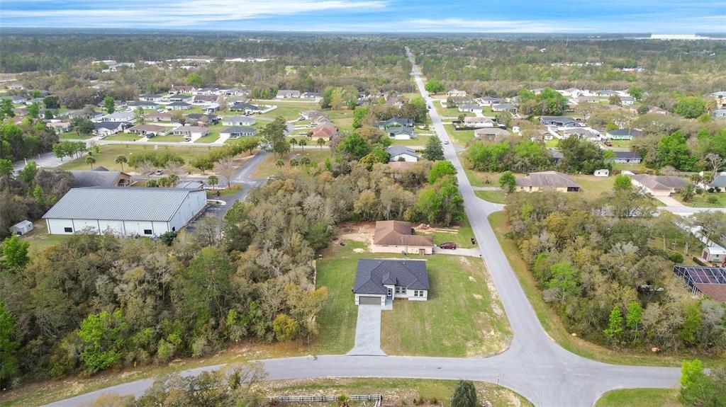 3172 Southwest 137th Loop Ocala, FL 34473 - Photo 36 of 38 an aerial view of residential houses with outdoor space