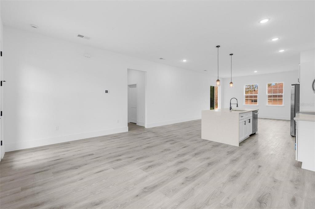 3172 Southwest 137th Loop Ocala, FL 34473 - Photo 5 of 38 a view of a kitchen with wooden floor