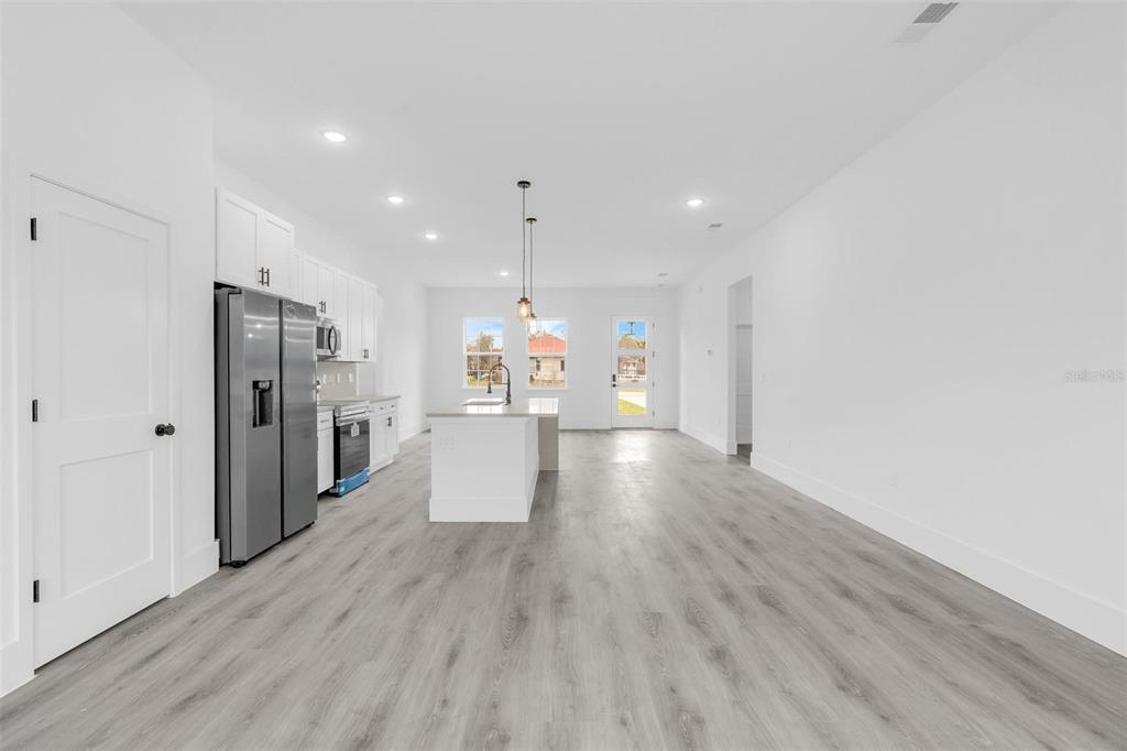 3172 Southwest 137th Loop Ocala, FL 34473 - Photo 7 of 38 a view of a kitchen with wooden floor