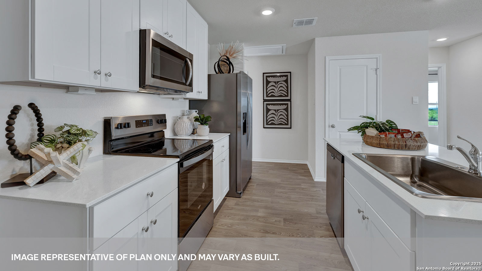 323 Low Pasture Trail Maxwell, TX 78656 - Photo 8 of 40 a kitchen with stainless steel appliances granite countertop a sink stove and cabinets