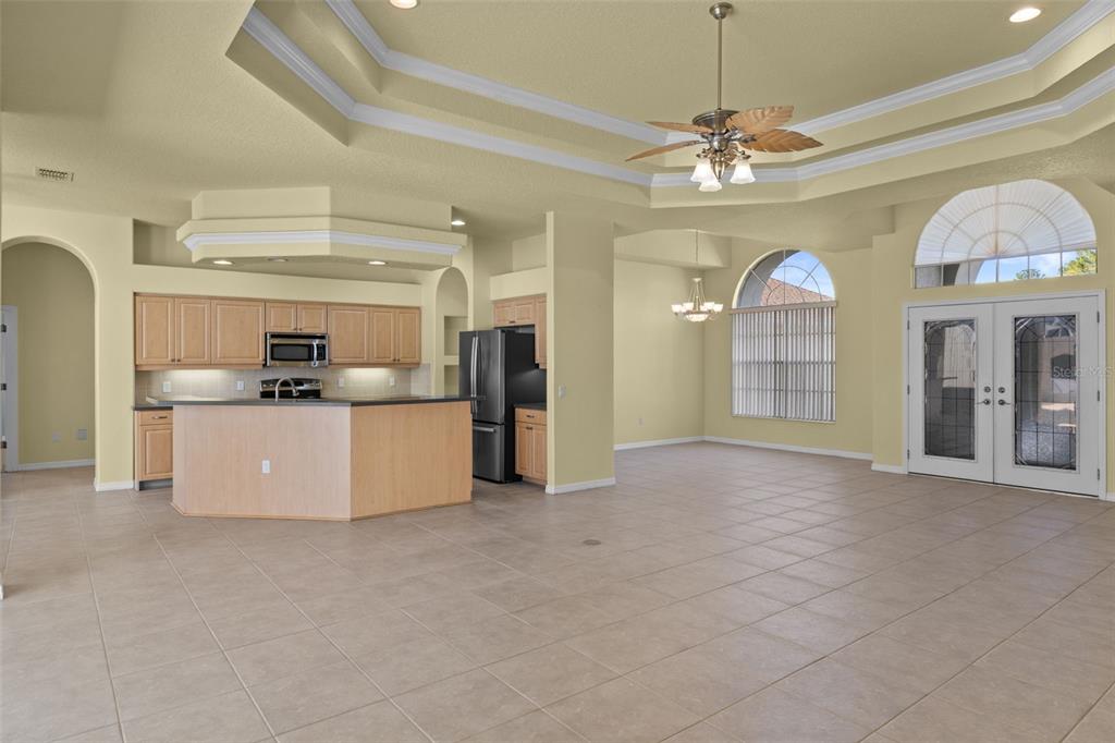 10130 Lazy Days Court Weeki Wachee, FL 34613 - Photo 15 of 85 a view of a kitchen with refrigerator and a sink
