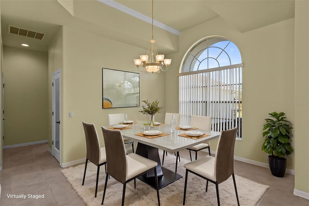 10130 Lazy Days Court Weeki Wachee, FL 34613 - Photo 17 of 85 a view of a dining room with furniture and chandelier