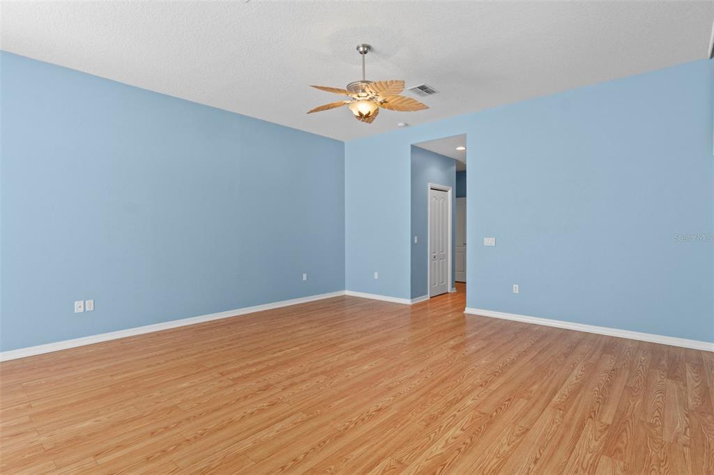 10130 Lazy Days Court Weeki Wachee, FL 34613 - Photo 39 of 85 a view of an empty room with a chandelier fan