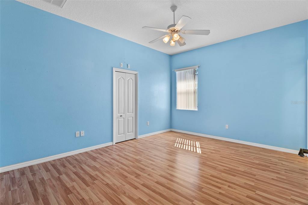 10130 Lazy Days Court Weeki Wachee, FL 34613 - Photo 47 of 85 a view of an empty room with wooden floor