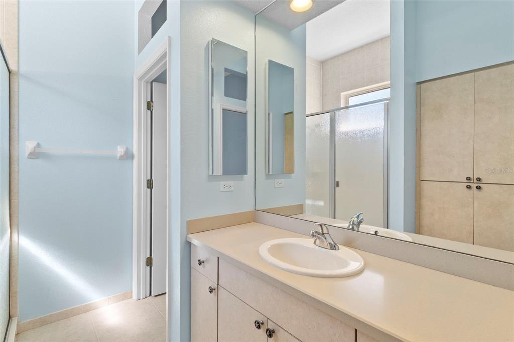 10130 Lazy Days Court Weeki Wachee, FL 34613 - Photo 50 of 85 a bathroom with a sink and a mirror