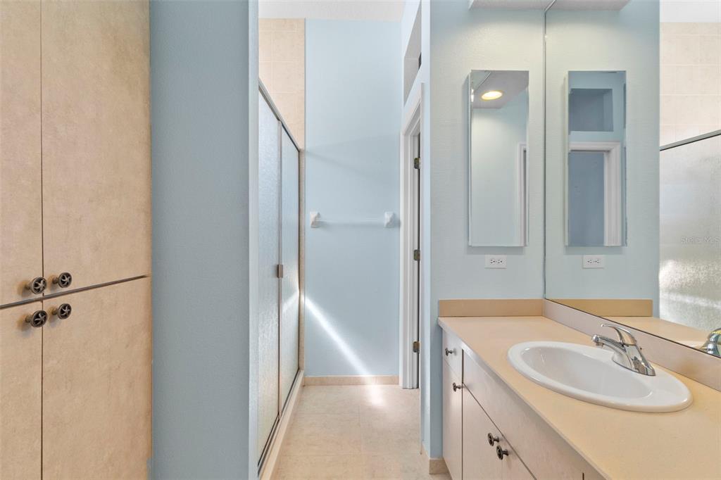 10130 Lazy Days Court Weeki Wachee, FL 34613 - Photo 51 of 85 a bathroom with a sink and a mirror