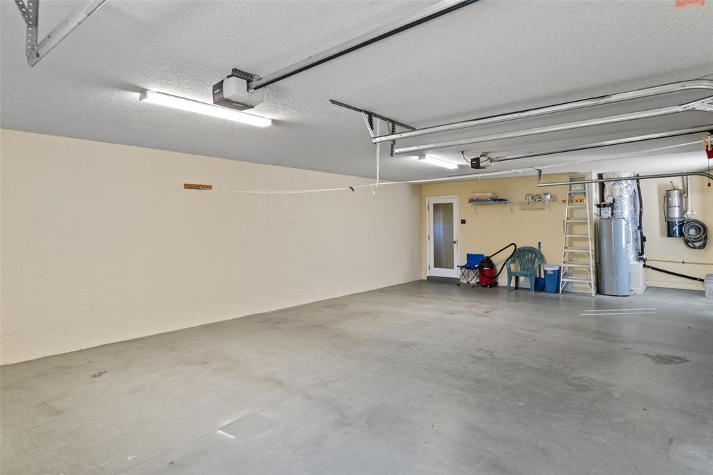 10130 Lazy Days Court Weeki Wachee, FL 34613 - Photo 60 of 85 a view of a car garage