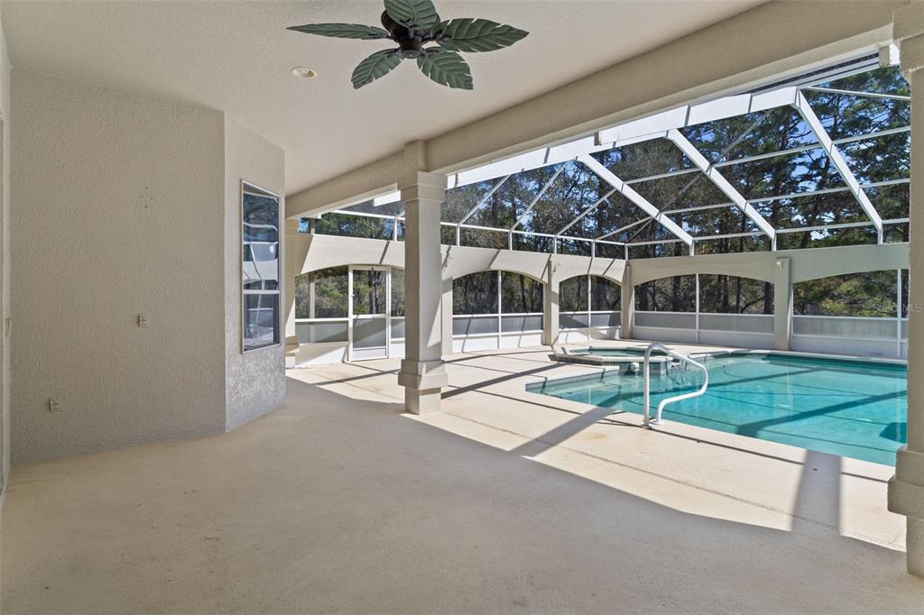 10130 Lazy Days Court Weeki Wachee, FL 34613 - Photo 62 of 85 a view of house with a big yard and balcony