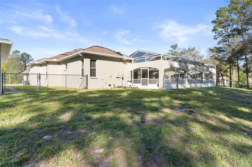 10130 Lazy Days Court Weeki Wachee, FL 34613 - Photo 76 of 85 a house view with a garden space