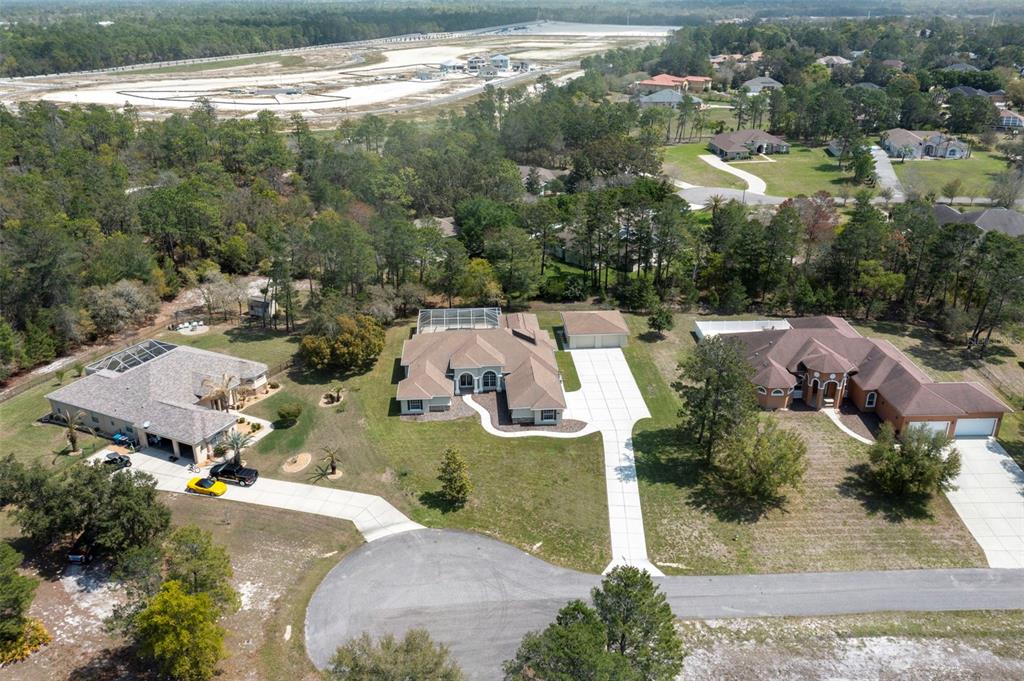 10130 Lazy Days Court Weeki Wachee, FL 34613 - Photo 80 of 85 an aerial view of residential house with outdoor space