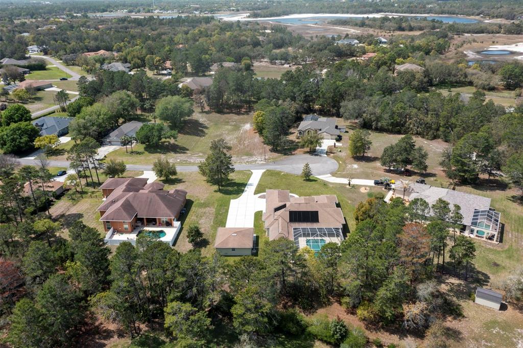 10130 Lazy Days Court Weeki Wachee, FL 34613 - Photo 83 of 85 an aerial view of residential houses with outdoor space and trees