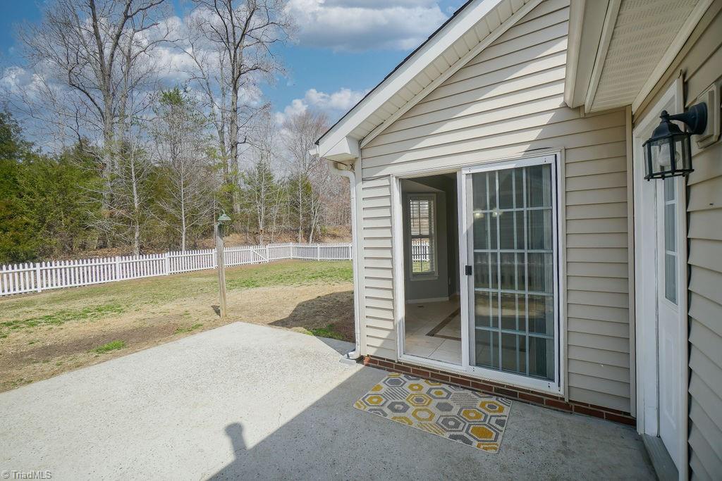 1128 Wesson Court High Point, NC 27265 - Photo 12 of 15 Dining room leads out to patio and fenced back yard.