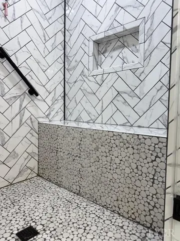 a view of a balcony with two chairs and a table