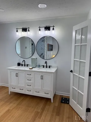 a kitchen with stainless steel appliances granite countertop a stove a microwave and cabinets