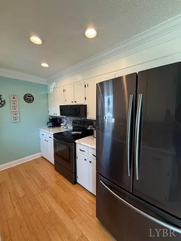 a bathroom with a shower and a glass door