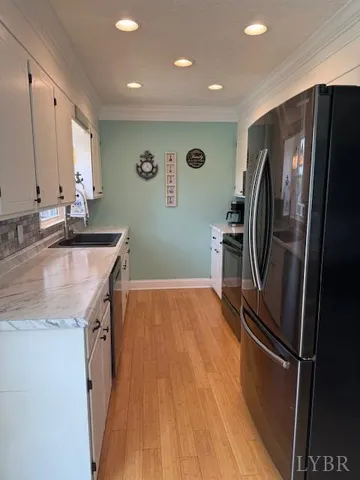 a bathroom with a granite countertop sink a toilet and a mirror