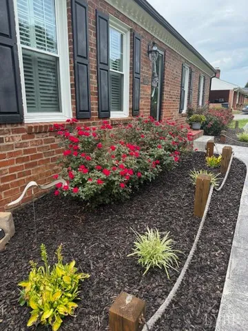 a front view of a house with sitting space