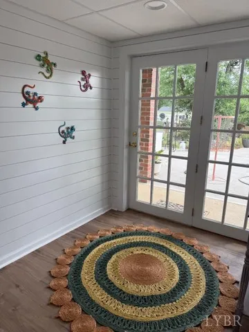 a backyard of a house with a large tree