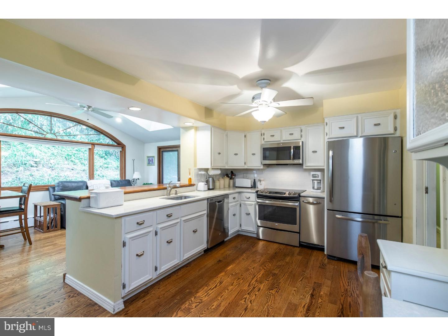 67 North Hillcrest Road Springfield, PA 19064 - Photo 12 of 23 a kitchen with stainless steel appliances granite countertop a stove refrigerator and a refrigerator