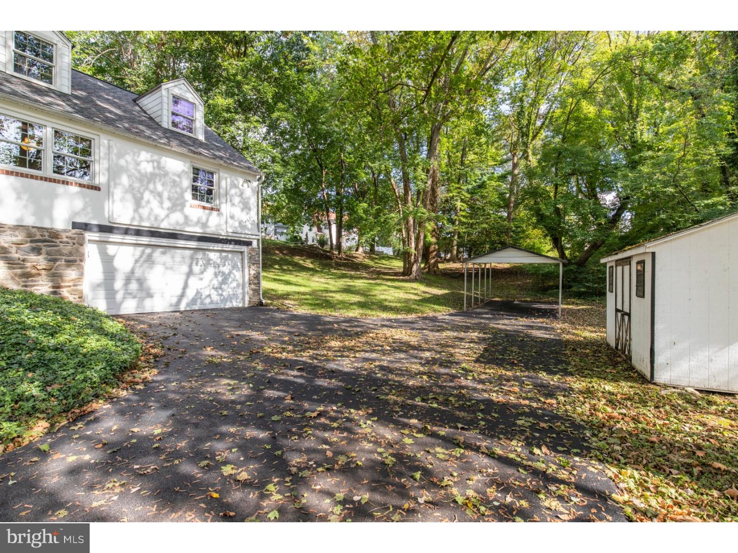 67 North Hillcrest Road Springfield, PA 19064 - Photo 3 of 23 a view of a backyard with large trees