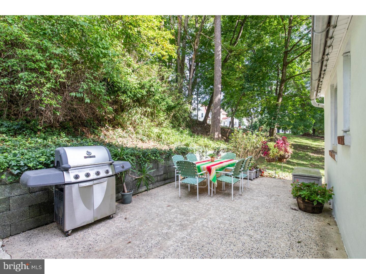 67 North Hillcrest Road Springfield, PA 19064 - Photo 7 of 23 a backyard of a house with table and chairs