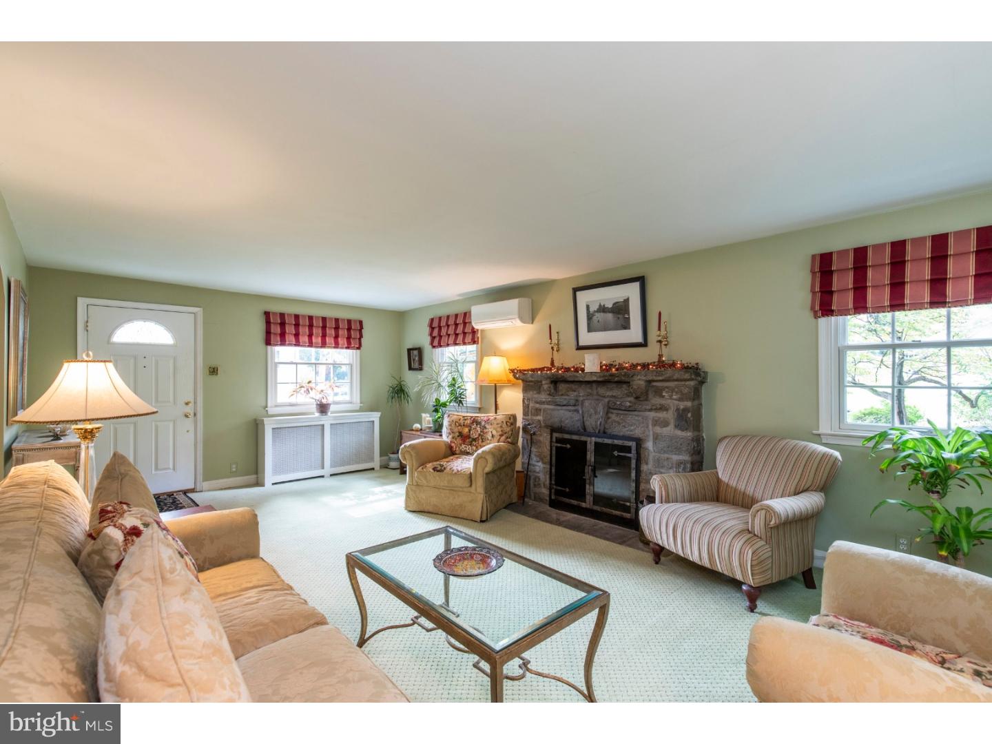 67 North Hillcrest Road Springfield, PA 19064 - Photo 9 of 23 a living room with furniture fireplace and a large window