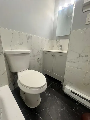 a bathroom with a toilet and a sink