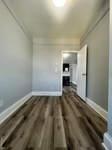 a view of wooden floor in an empty room