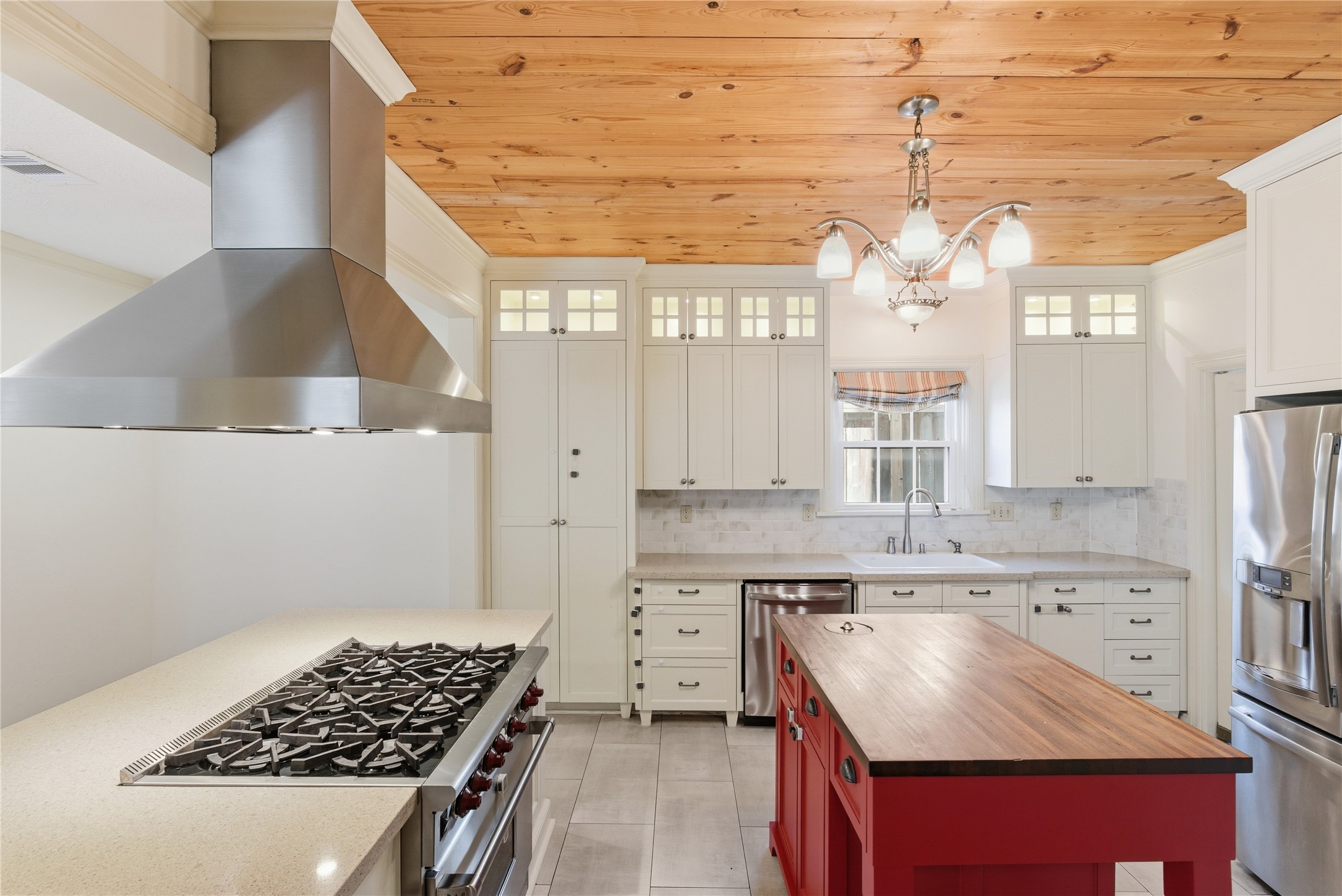 6666 Fairfield Street Houston, TX 77023 - Photo 14 of 48 a kitchen with a stove a sink and a refrigerator