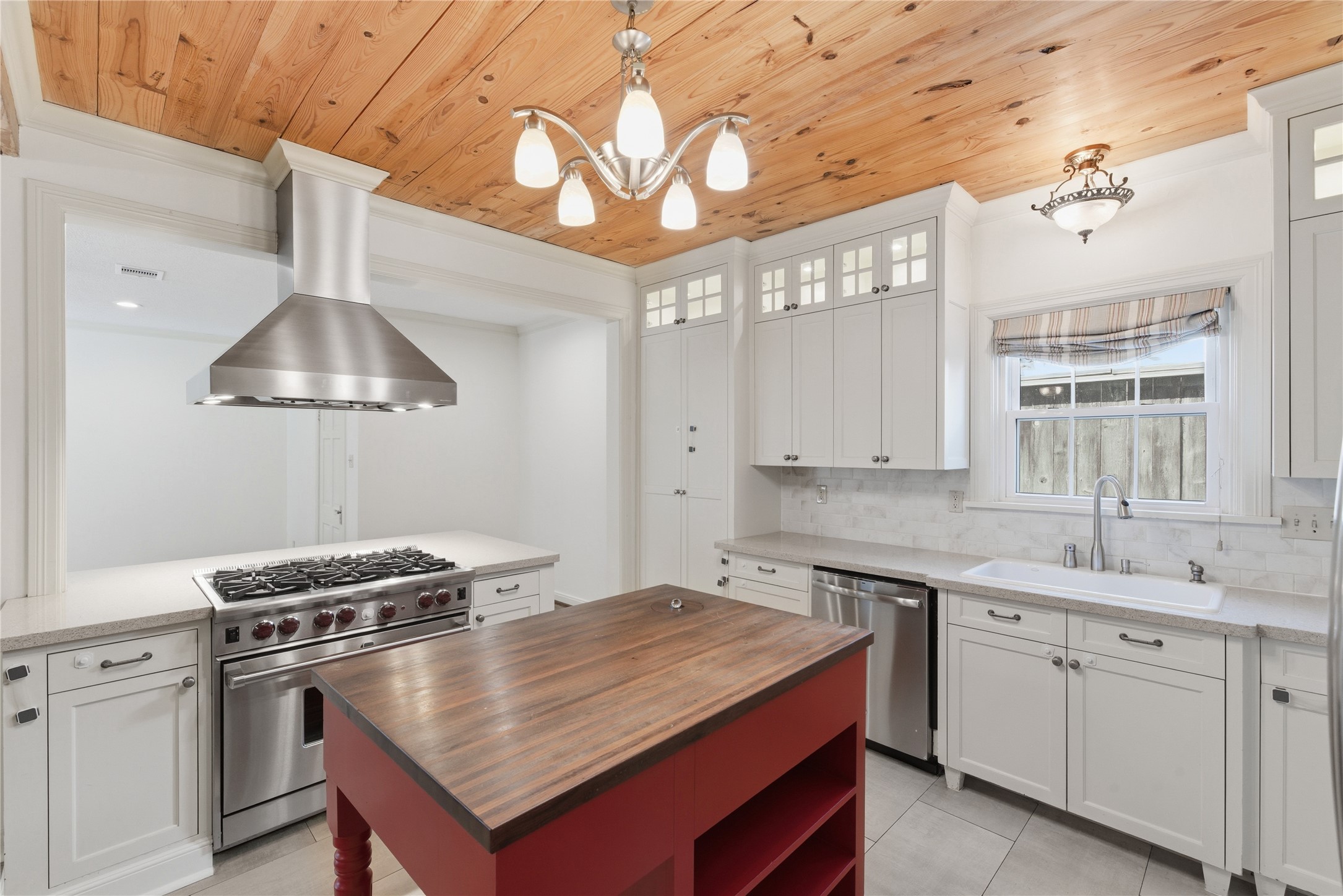 6666 Fairfield Street Houston, TX 77023 - Photo 15 of 48 a kitchen with a stove a sink and a refrigerator