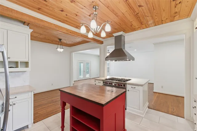 a kitchen that has a stove and a table