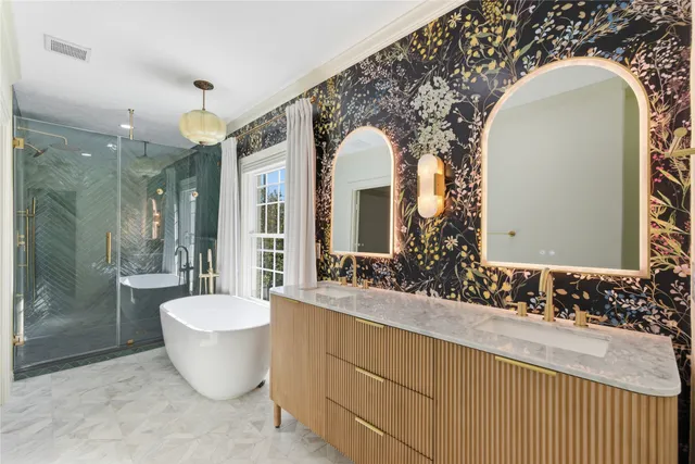 a large bathroom with a bathtub and sink