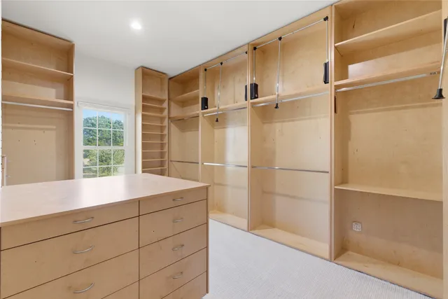 a view of walk in closet with window