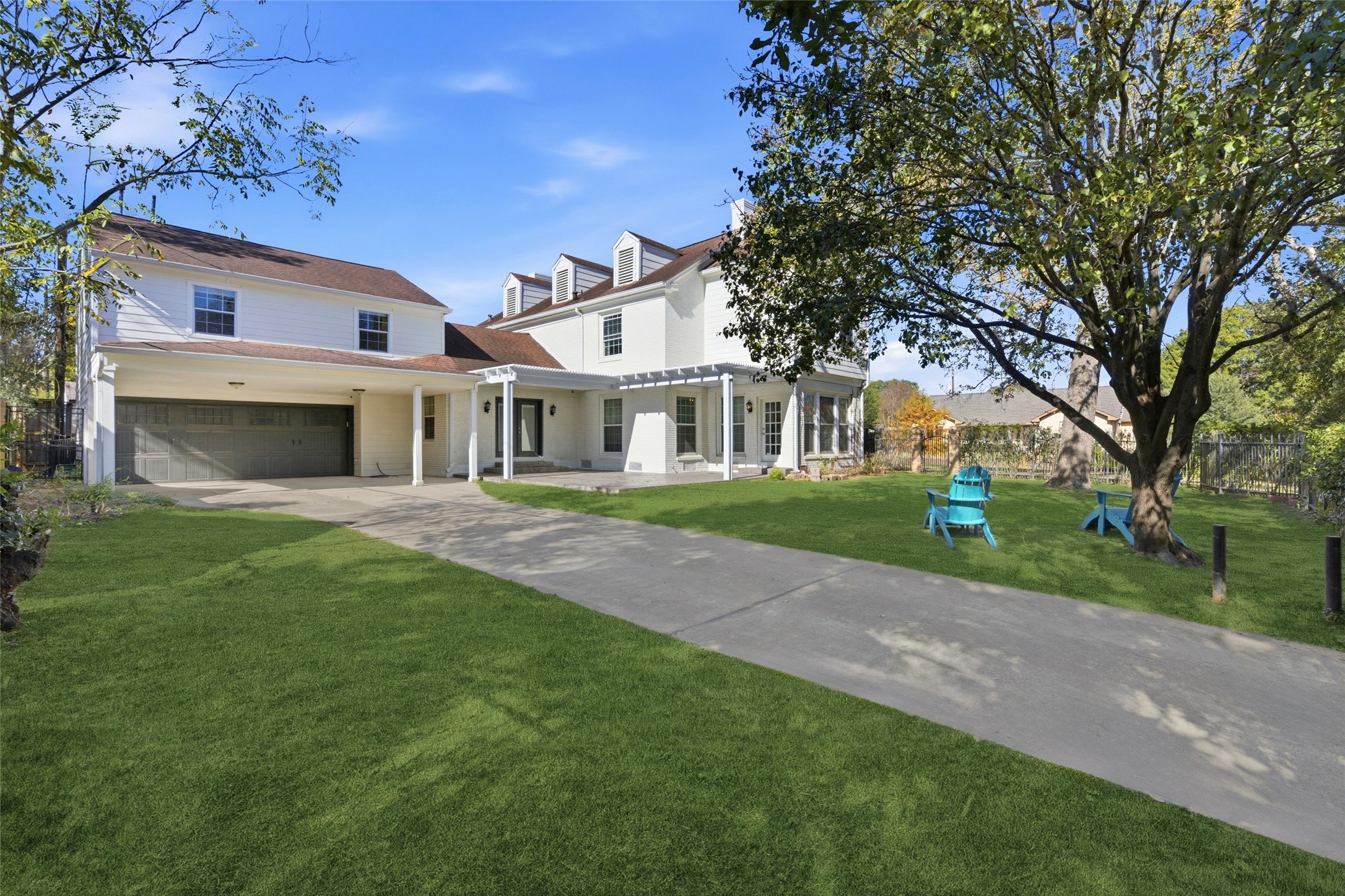 6666 Fairfield Street Houston, TX 77023 - Photo 45 of 48 a front view of a house with a garden and trees