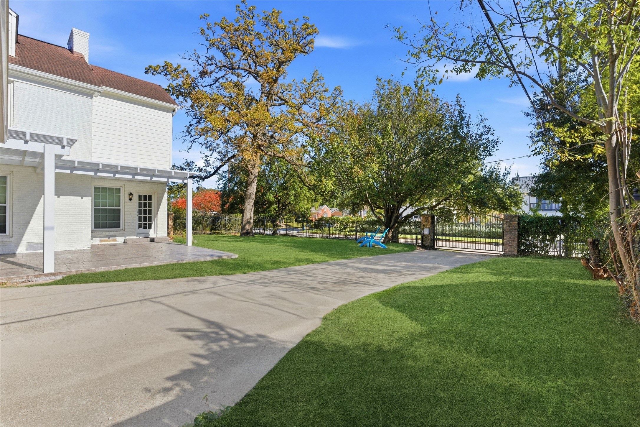 6666 Fairfield Street Houston, TX 77023 - Photo 46 of 48 a view of a white house with a big yard and large trees
