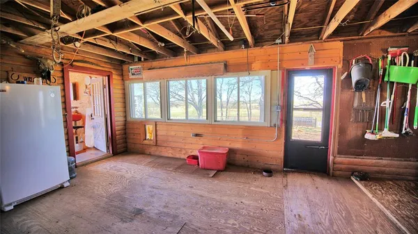 a view of a garage with wooden wall
